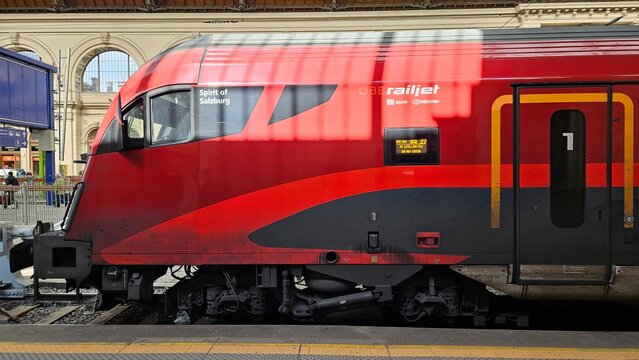 Red Railjet Train at Station