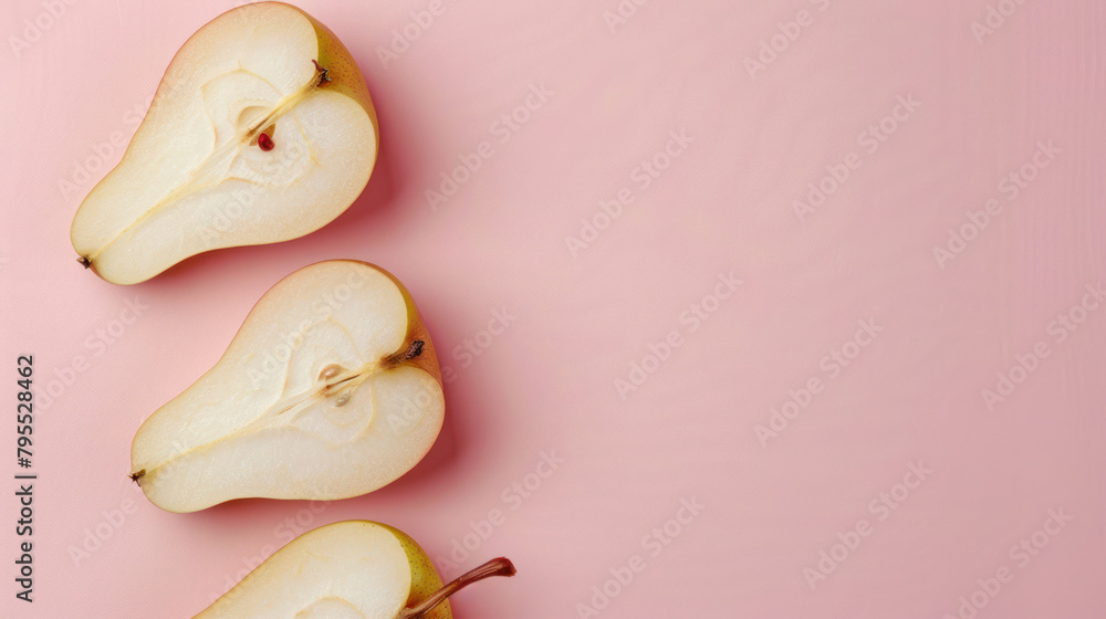 Wall mural Three pieces of pear on pink background