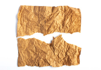 Crumpled brown paper. Background made of natural paper with tears on a white background