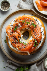 Top-Down Elegant Smoked Salmon Bagel. Top view of a bagel with smoked salmon and cream cheese, ideal for food and culinary themes.