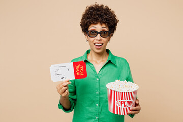 Young woman of African American ethnicity in green shirt casual clothes 3d glasses watch movie film...