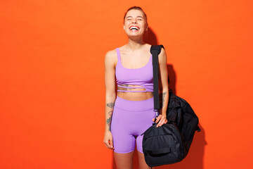 Young fun fitness trainer instructor sporty woman sportsman wear purple top clothes spend time in...