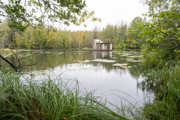 old building in a lake in the forest, Finland
