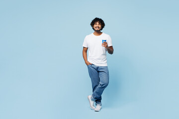 Full body young happy Indian man he wear white t-shirt casual clothes hold takeaway delivery craft...