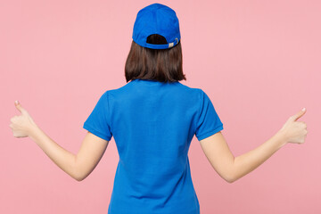 Back rear view professional delivery girl employee woman wear blue cap t-shirt uniform workwear...