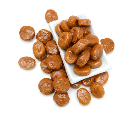 Caramel candies isolated on white background