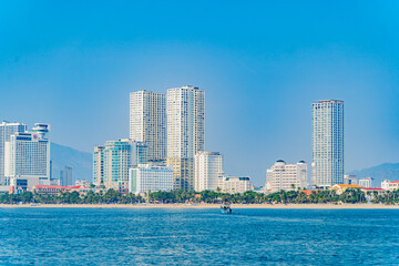 Fototapeta premium The city is from a distance from the sea. Nha Trang city in Vietnam. View of the city from the sea.