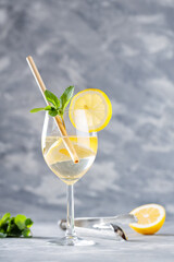 Hugo Spritz Cocktail in Glass Garnished with Mint and Lemon, Cold Refreshing Summer Alcoholic Drink