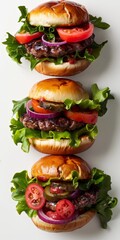 Three hamburgers stacked on top of each other