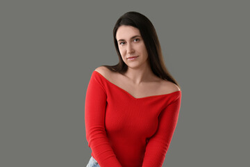 Obraz premium Portrait of beautiful young woman on grey background