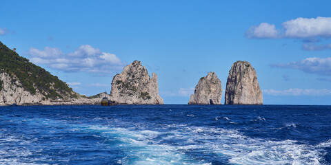 Fototapeta na wymiar Faraglioni di Capri, rock formations by the island of Capri in the Campanian Archipelago, Italy