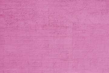 Unevenly plastered pink old wall. Abstract construction background