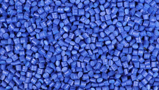 Plastic granules background 360 degrees of spin around themselves blue vortex