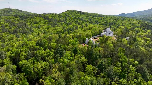 Uhuburg castle in Helen Georgia drone photograph. Smooth aerial drone footage of the Uhuburg castle in Helen Georgia. Footage taken on 4-24-204 in Helen Georgia, U.S.A. Green forest trees and majestic