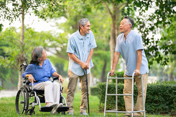 group of senior people with rehabilitation equipment enjoy talking together, friends spend their...