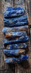A row of blue crystals on a wooden surface