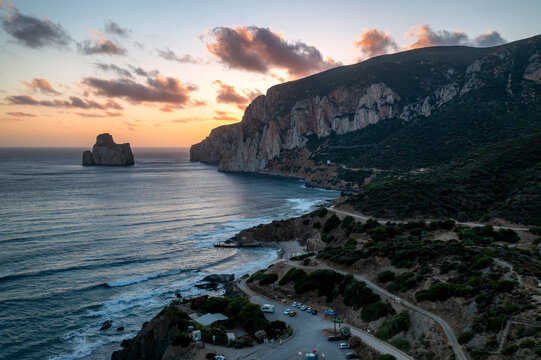 Sunset view of Sardinian coastline and cliffs, Masua beach