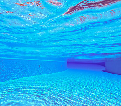 Underwater view of clear blue swimming pool