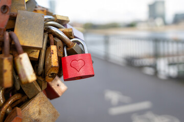 many love locks on a bridge