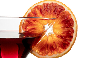 Slice of blood orange on cocktail glass isolated on white background. Close up.
