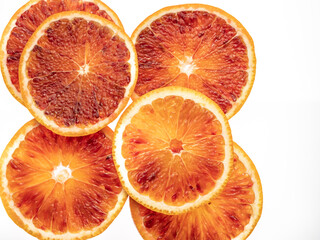 Red blood orange fruit slices isolated on white background
