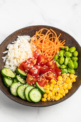 poke bowl with fresh cucumbers, carrots, edamame beans, corn, rice and sesame seeds, Bowl of healthy food on white background