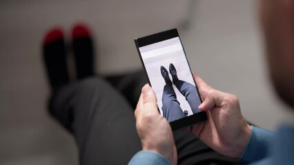 Man Trying Virtual Sneakers In Shop
