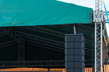 Large indoor outdoor stage for concerts. Professional sound and lighting equipment on stage....
