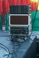 Professional sound and lighting equipment on stage. Monitor speakers for concerts and events.