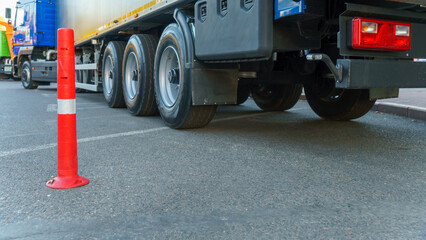 A new truck with a trailer on the road. Details of the truck in close-up. New headlights and wheels...