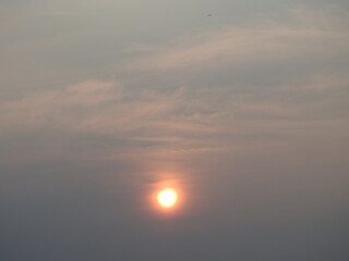 A fiery sunset, in a cloudy evening sky, over the Bombay Hook National Wildlife Refuge, Kent County, Delaware. 