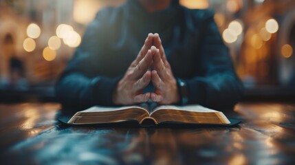 Praying hands with faith in religion and belief in God with Bible. - obrazy, fototapety, plakaty