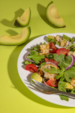 Arugula sald with avocados, tomatoes