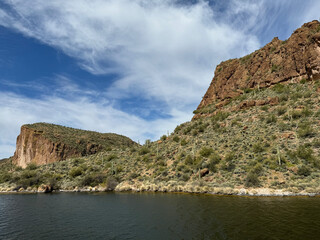 View from a steamboat, of Canyon Lake reservoir and rock formations in Maricopa County, Arizona in the Superstition Wilderness of Tonto National Forest near Apache Trail.  The lake was formed by dammi