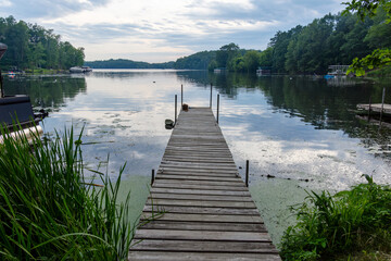 Looking down a pier on a  lake in northern Wisconsin at sunset.