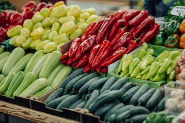 Cropped picture of various vegetables in crates at farmers market.