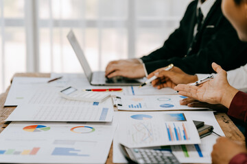 Corporate business people working in busy marketing office space, planning strategy in books and reading email on laptop at work, workers at startup advertising company