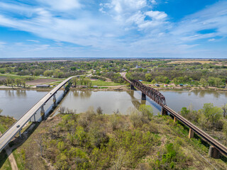 Highway and railroad bridges across the Missouri RIver at Rulo, Nebraska, springtime aerial view
