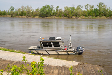 aluminum working boat at a ramp on the MIssouri River at Waverly, MO - 795730409