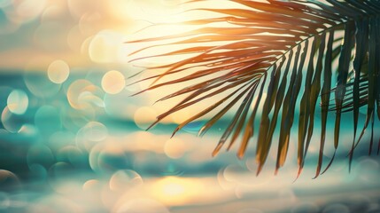 Fototapeta na wymiar A captivating image of a green palm leaf softly blurred in the foreground, with a sunlit tropical beach as the backdrop