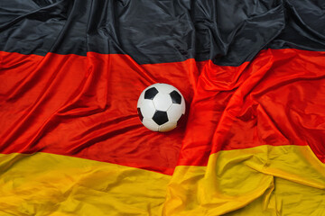 German soccer ball and flag with big copy space.