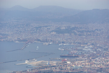 View from the top of Mount Vesuvius down to the city on a hazy winter day, Naples, Campania, Italy