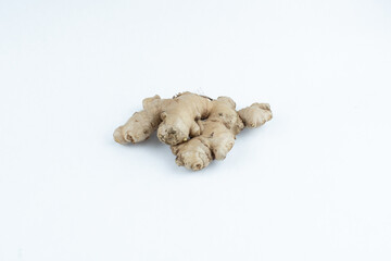 Raw fresh uncut ginger root on white background