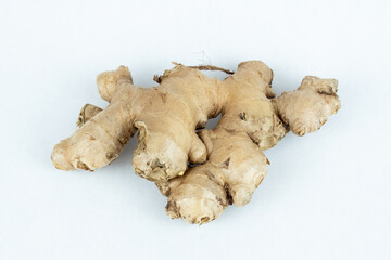 Raw uncut ginger root on white background