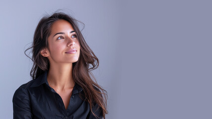 Side view of Hispanic businesswoman wearing black shirt, smiling candid