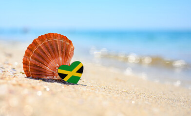 Sandy beach in Jamaica. Jamaica flag in the shape of a heart and a large shell. A wonderful resort...