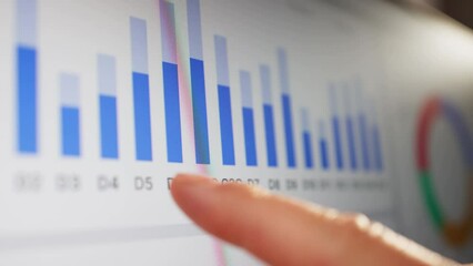 Close-up Of Businessman Analyzing Graph - Powered by Adobe