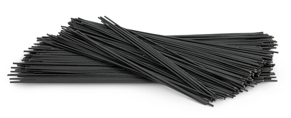 uncooked black spaghetti isolated on white background