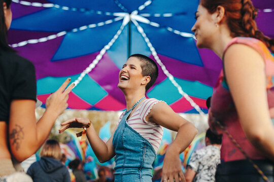 Friends dancing and having a good time at a summer music festival