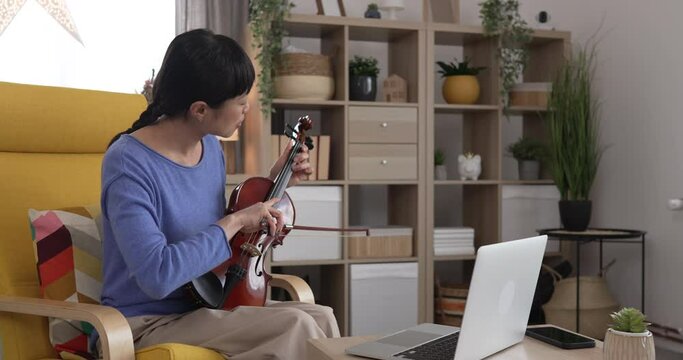 Mature japanese woman have online class learn how to play violin